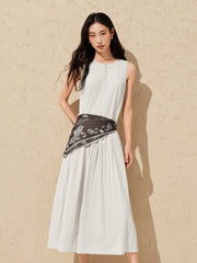 Women's white sleeveless dress with a scarf