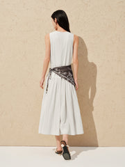 Women's white sleeveless dress with a scarf