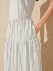 Women's white sleeveless dress with a scarf