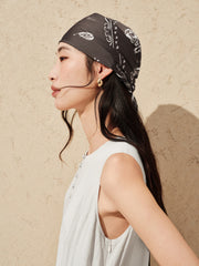 Women's white sleeveless dress with a scarf