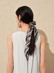 Women's white sleeveless dress with a scarf