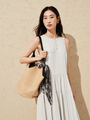 Women's white sleeveless dress with a scarf