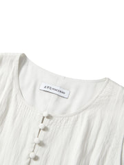 Women's white sleeveless dress with a scarf