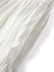 Women's white sleeveless dress with a scarf