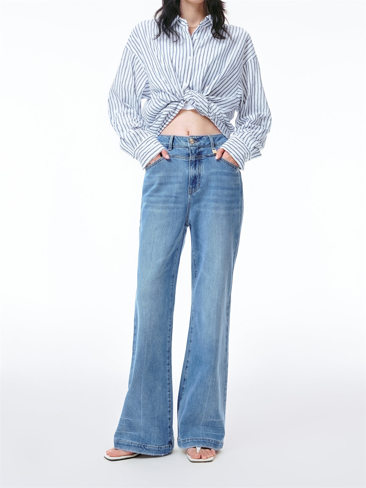 Women's Washed Flared Jeans with Distressed Hem