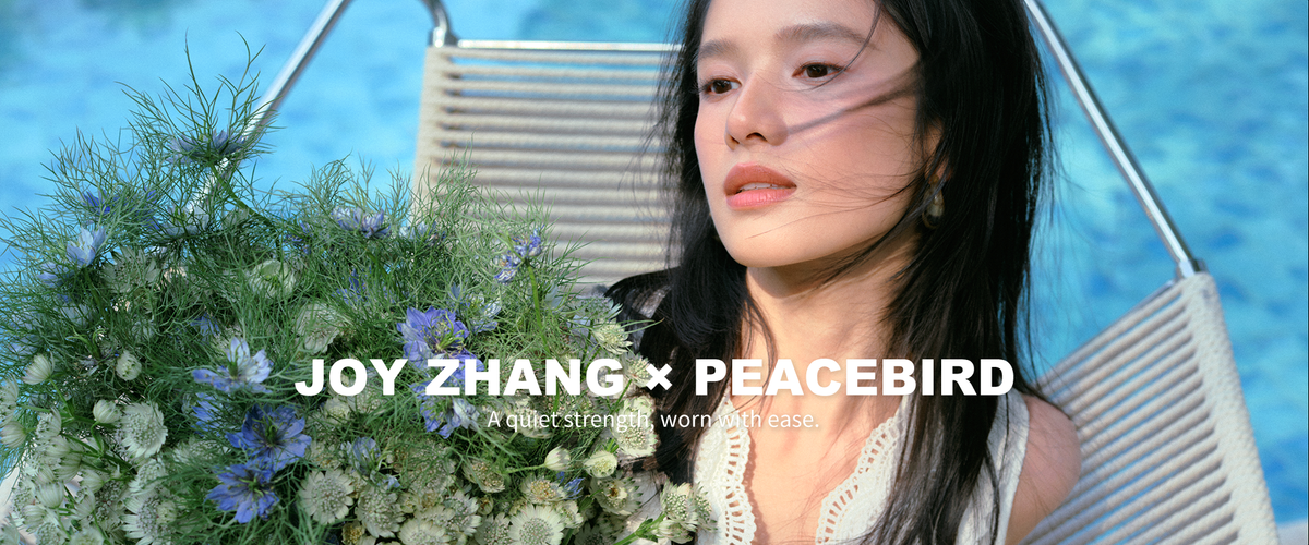 Peacebird womenswear campaign image with flowers and a summer outfit